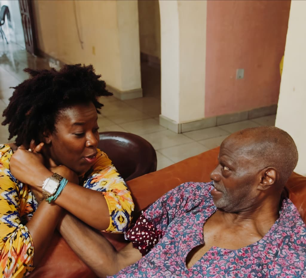 Chief (Arc.) Isaac Fola-Alade in conversation with his daughter.