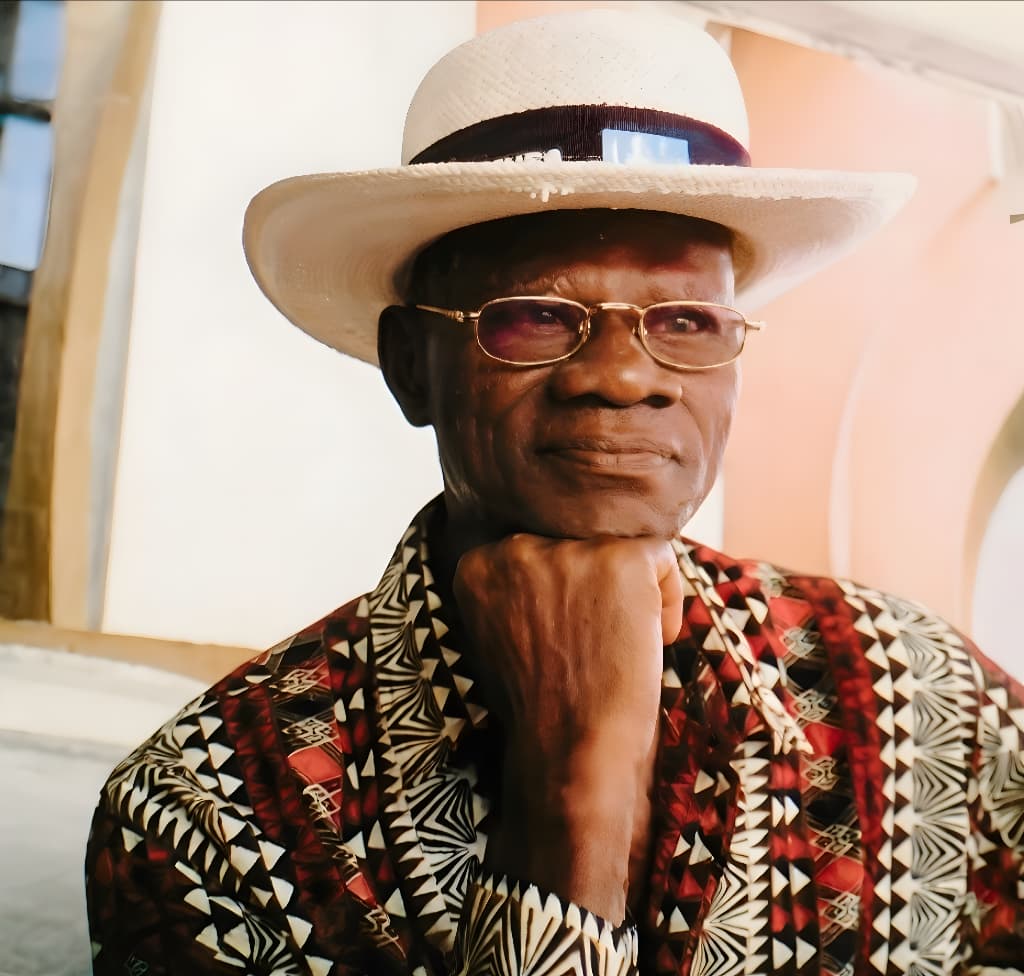 Chief Fola Alade in a wide-brim white hat