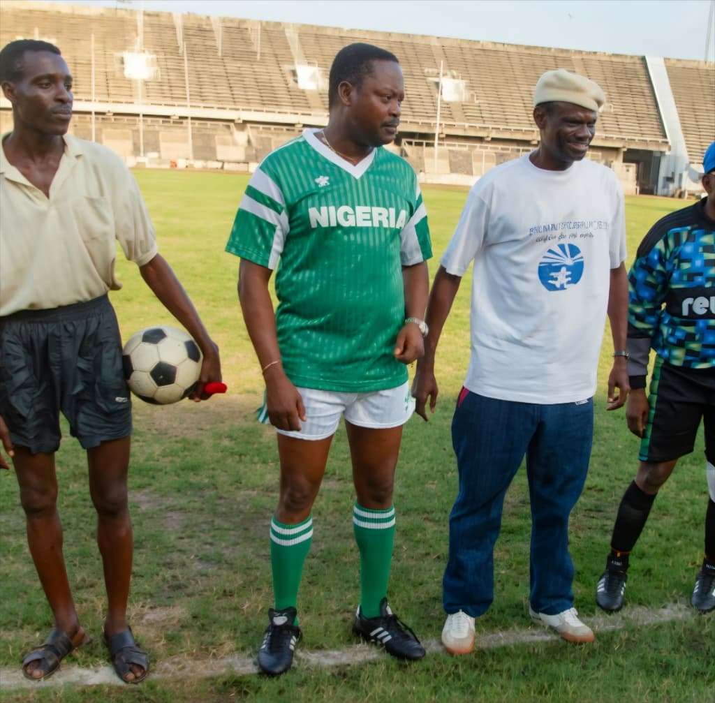 Chief (Arc.) Isaac Fola-Alade in a Nigeria jersey at the National Stadium.